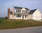 Home with lawn showing signs of drought